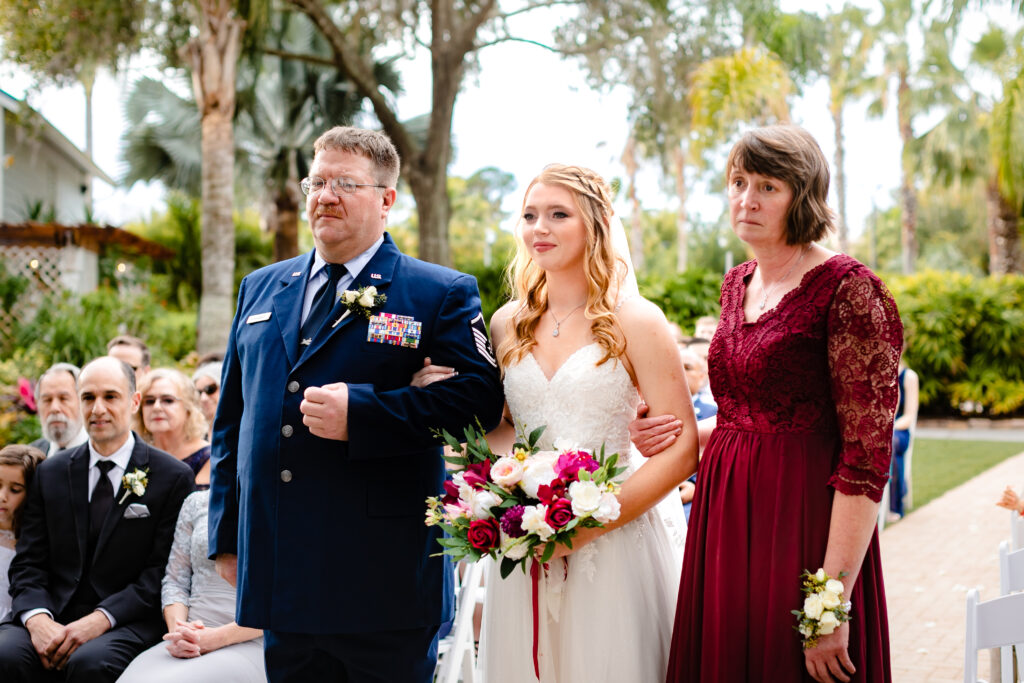 The-Bride-with-Parents-Going-Down-the-Aisle