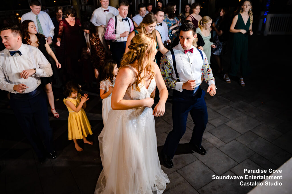 Military-Paradise-Cove-Newlyweds-Celebrating-With-Guests